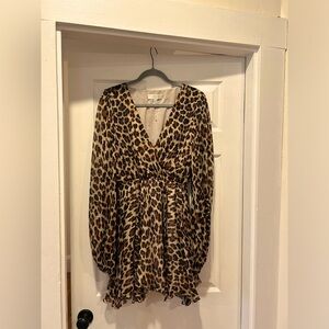 Flowing leopard print silk mini dress.